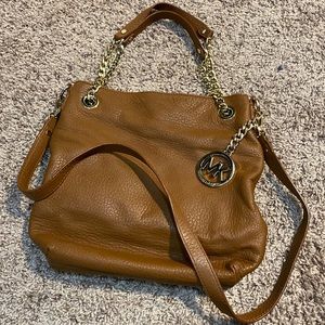 Brown Michael Kors handbag with duster